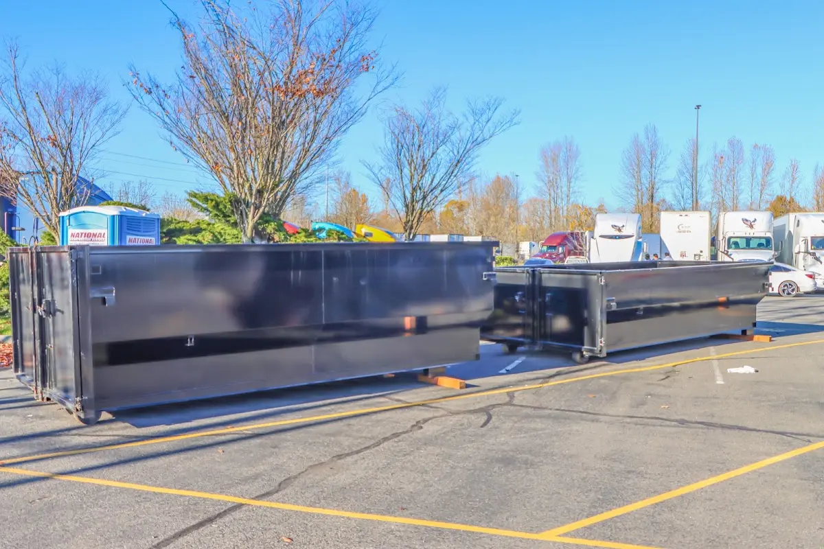 Professional dumpster rental service with roll-off container on residential driveway in Cary